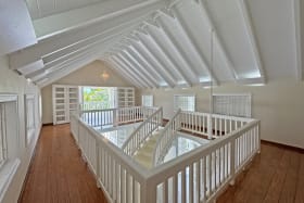 Upper level wrap around has wooden floors