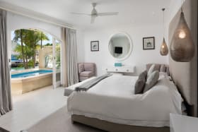 The primary suite opens out to the pool terrace