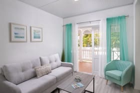 Airy living area with access to patio