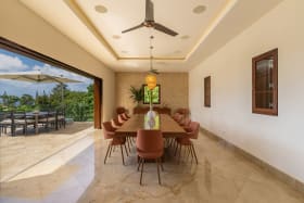 Dining Room Accented With A Mother Of Pearl Wall And Stunning Sea Views