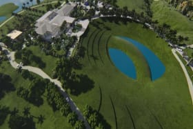 Aerial view showing clubhouse, half way house and 19th hole lake island green