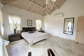 Primary bedroom with high ceilings