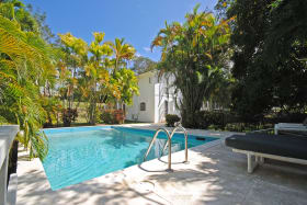 View of swimming pool and house