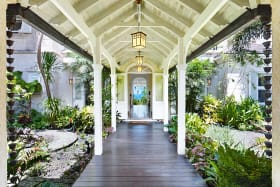 Covered entrance walkway through the tropical gardens