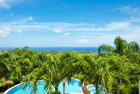 Stunning views of the pool, garden and ocean beyond