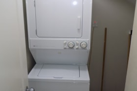 Washer and dryer combo in utility room