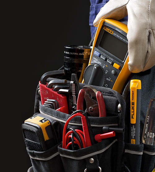 Fluke 110 DMM in electricians tool holster