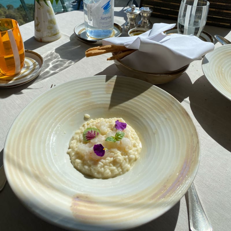 Riso Carnaroli mantecato al Prosecco, tartara di scampi con polvere di liquirizia  - La Terrazza