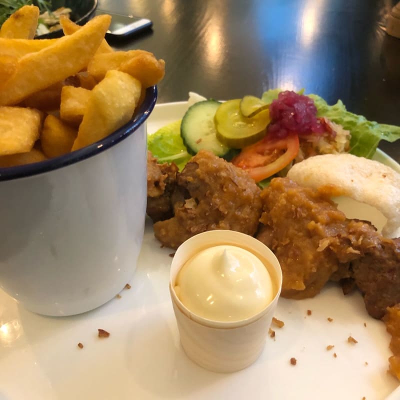 Traditional Dutch food served with fries and mayonnaise. Local beer recommended as a refreshing drink. - Brasserie De Roode Leeuw, Amsterdam