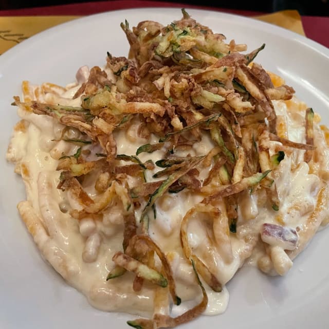 Passatelli in crema di parmigiano speck e zucchine fritte - Il Santo bevitore Bologna, Bologna