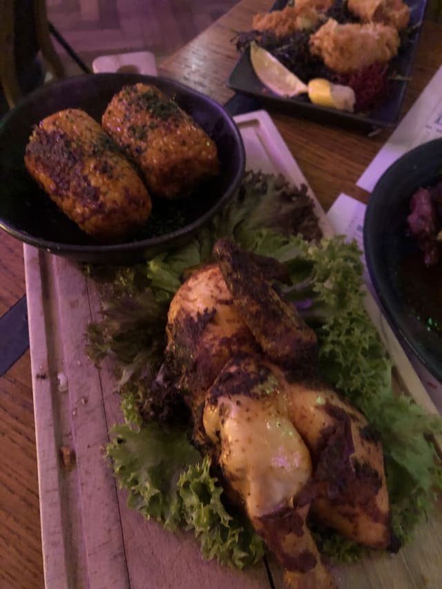 ½ chicken prepared on charcoal - Oslo Beers