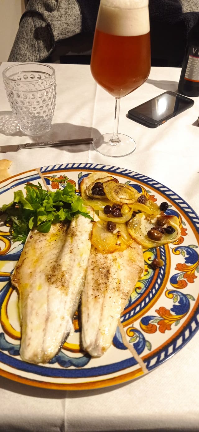 Branzino al forno con Patate,Cipolle Bianca e Olive Taggiasche  - Cozzeria Pluma, Pistoia