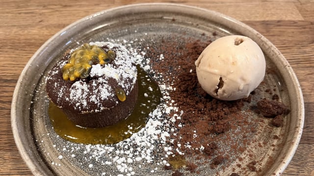 Chocolate cake with São Tomé’s cocoa, passion fruit and hazelnut ice cream - La Table des Anges, Paris