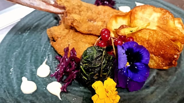 La costoletta di abbacchio di trastevere con cicorietta di campo ripassata e sfoglie di patate al forno - Vista Trastevere Roof Bar & Restaurant by “UNA cucina", Rome