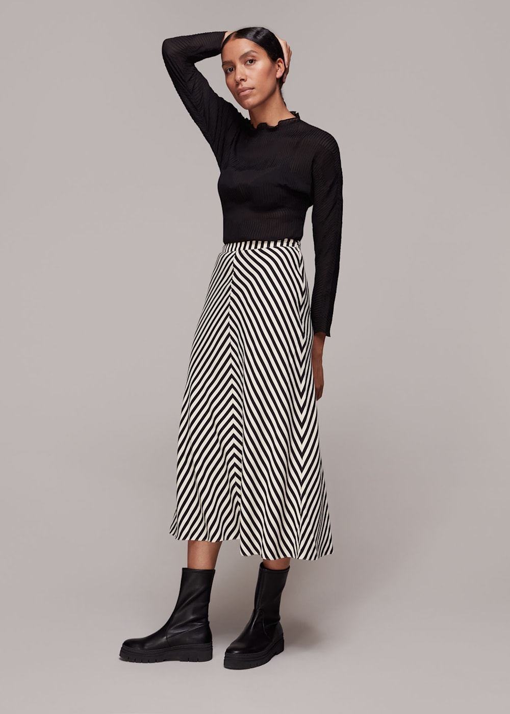 Black and white striped skirt 7 little words hot sale