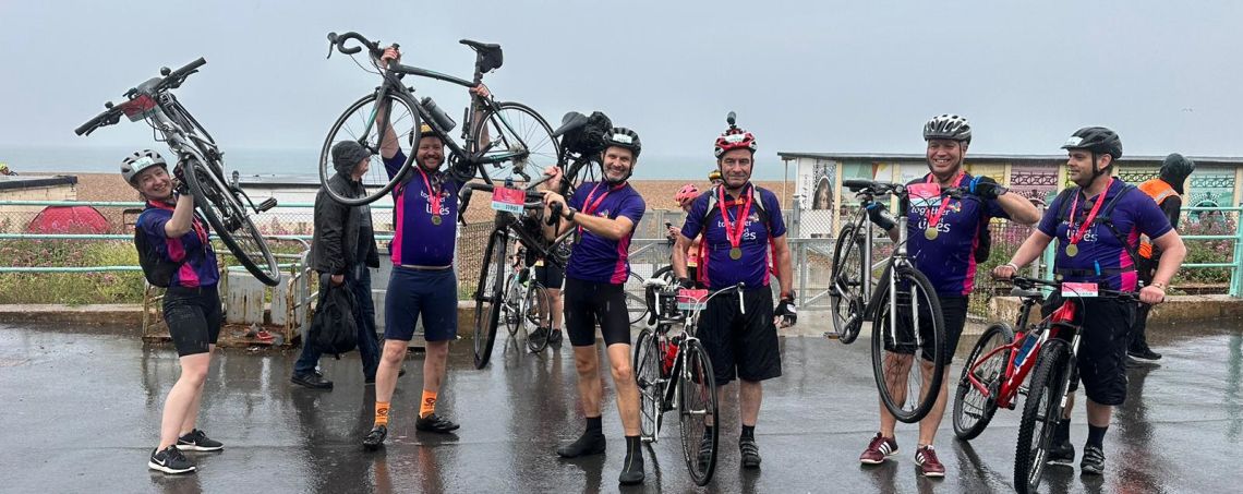 A group of cyclists celebrating