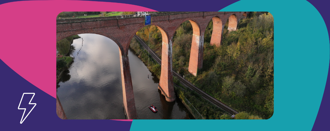 A person bungee jumping off a tall bridge