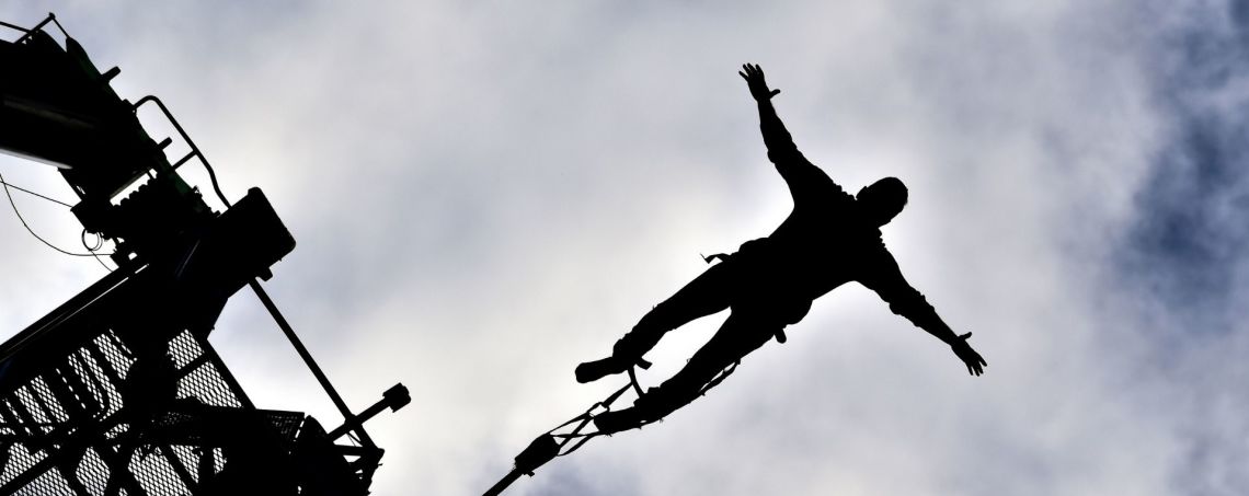 Silhouette of a bungee jumper