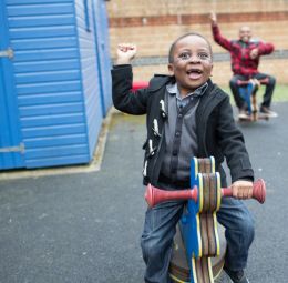 two boys on static rocking horses