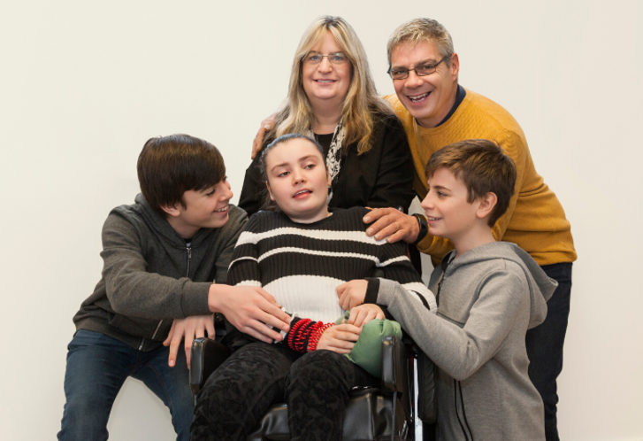 Family with daughter in wheelchair