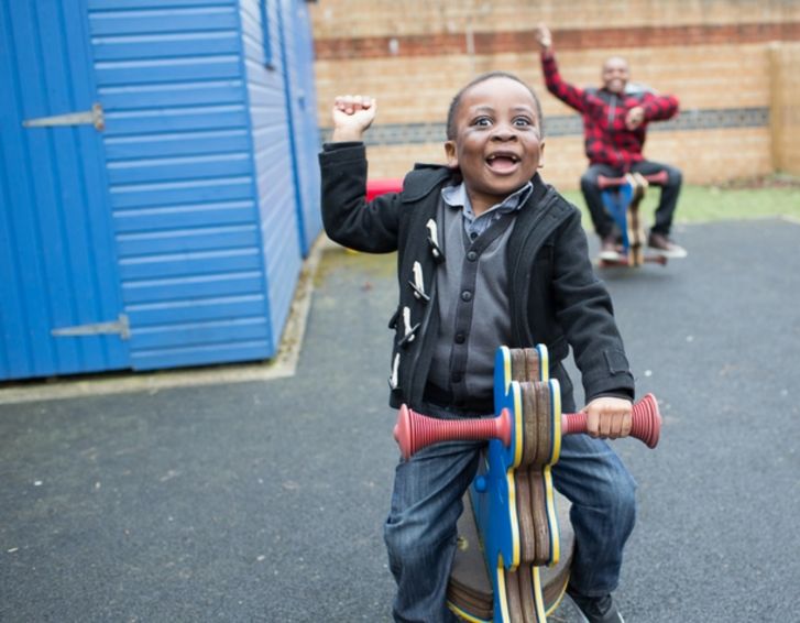 two boys on static rocking horses