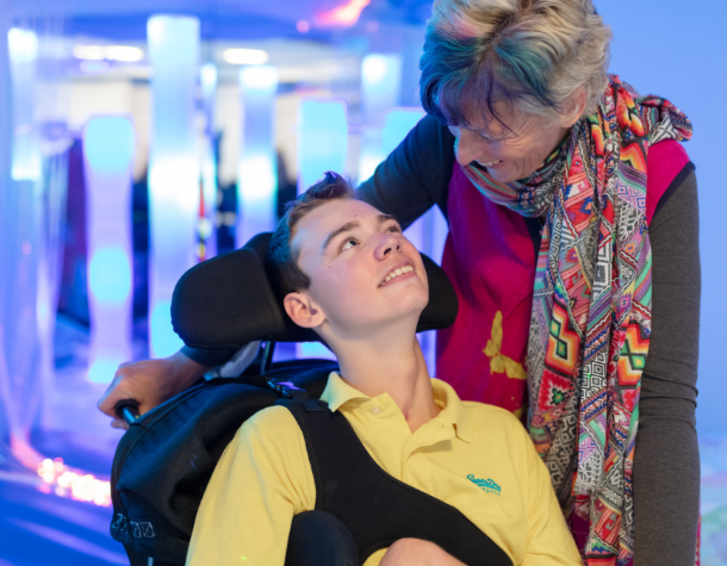 Young adult with carers