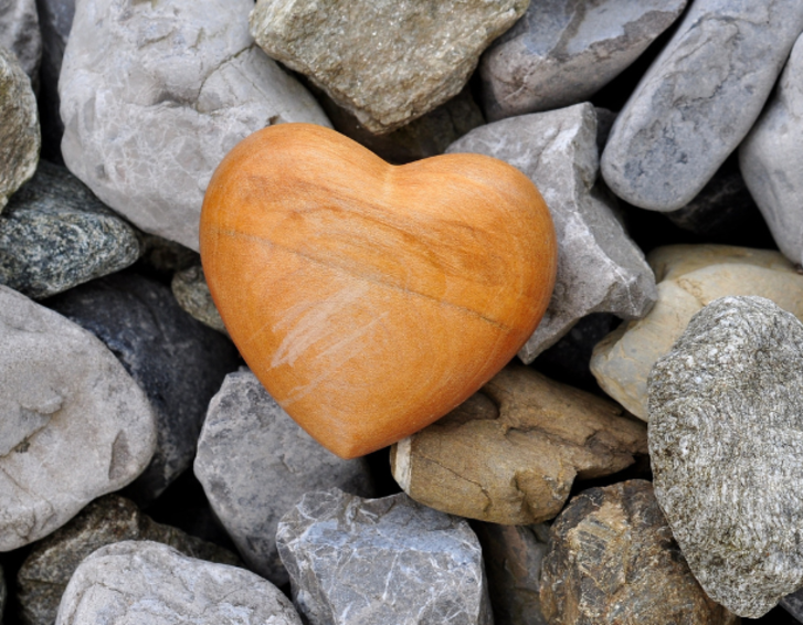 Poignant image of a heart shaped stone