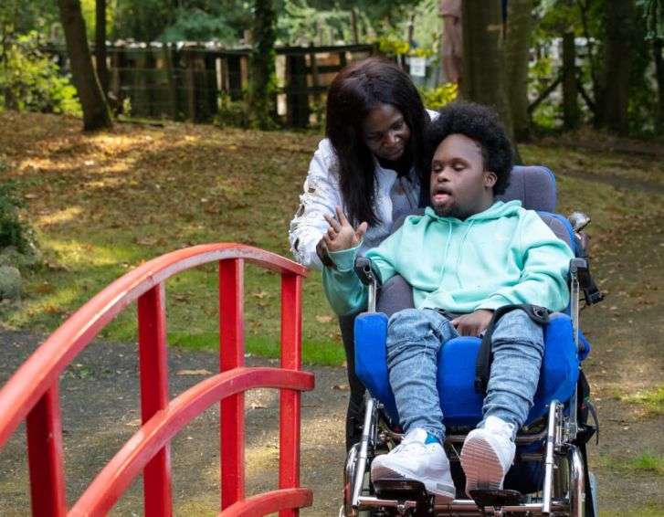 Boy in wheelchair with Mum