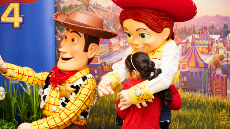 Woody and Jessie with little girl
