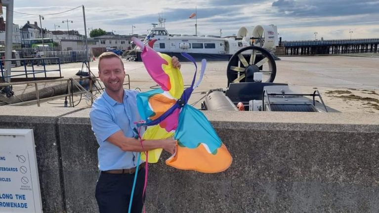 Man holding butterfly kite