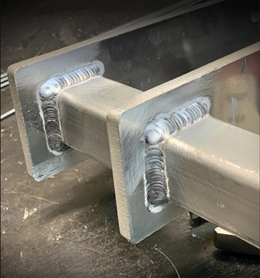 Square tube welded to plates