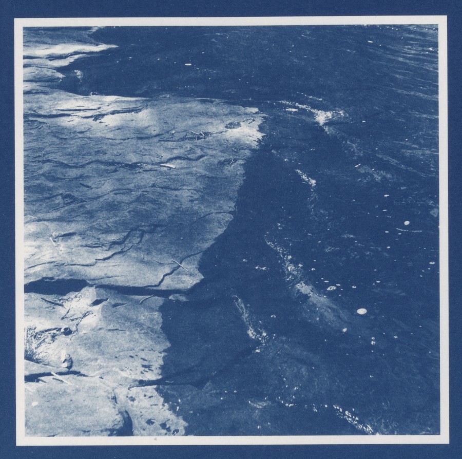 A photo of a landscape with a dark blue wash over it