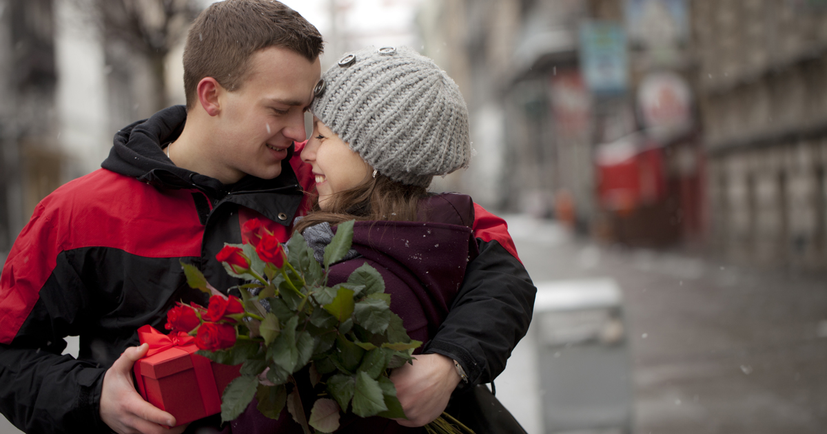 A man giving his partner a valentine's day gift A man giving his partner a valentine's day gift