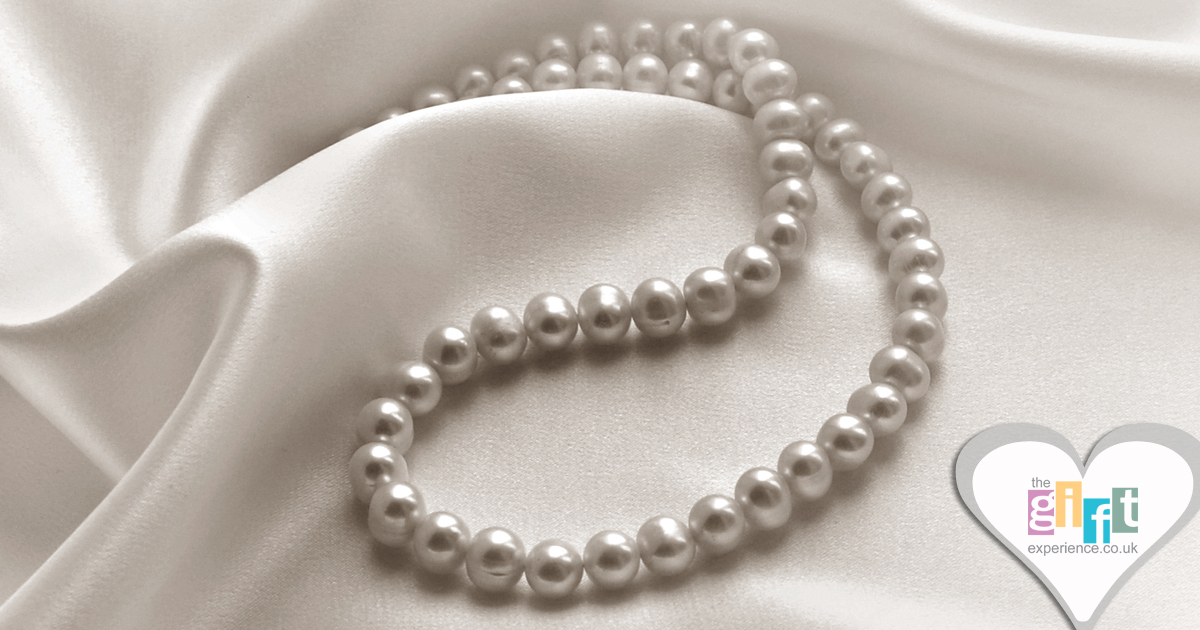pearl necklace on cream silk pearl necklace on cream silk