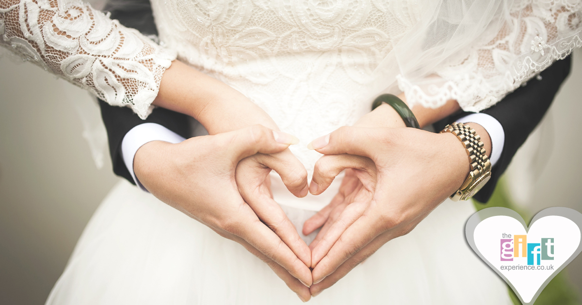 Bride and Groom making a heart with their hands Bride and Groom making a heart with their hands