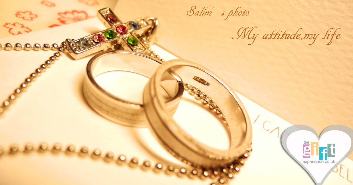 Wedding rings and a cross on paper Wedding rings and a cross on paper
