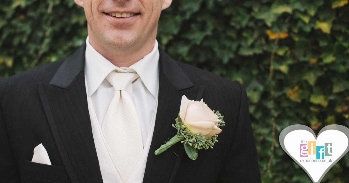 A groom in his wedding attire A groom in his wedding attire