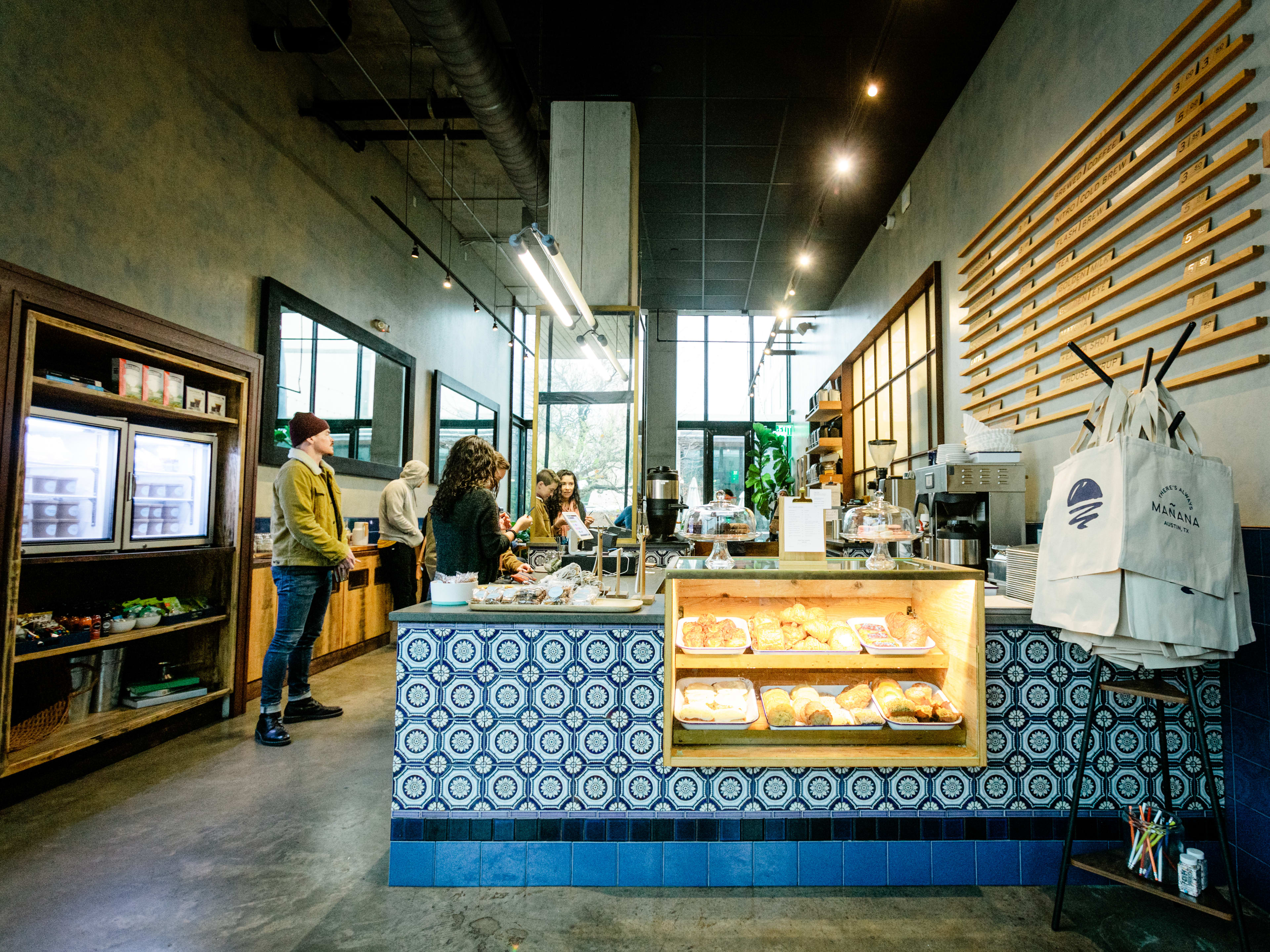 Bright tiled counter and warm interior at Mañana café in Austin