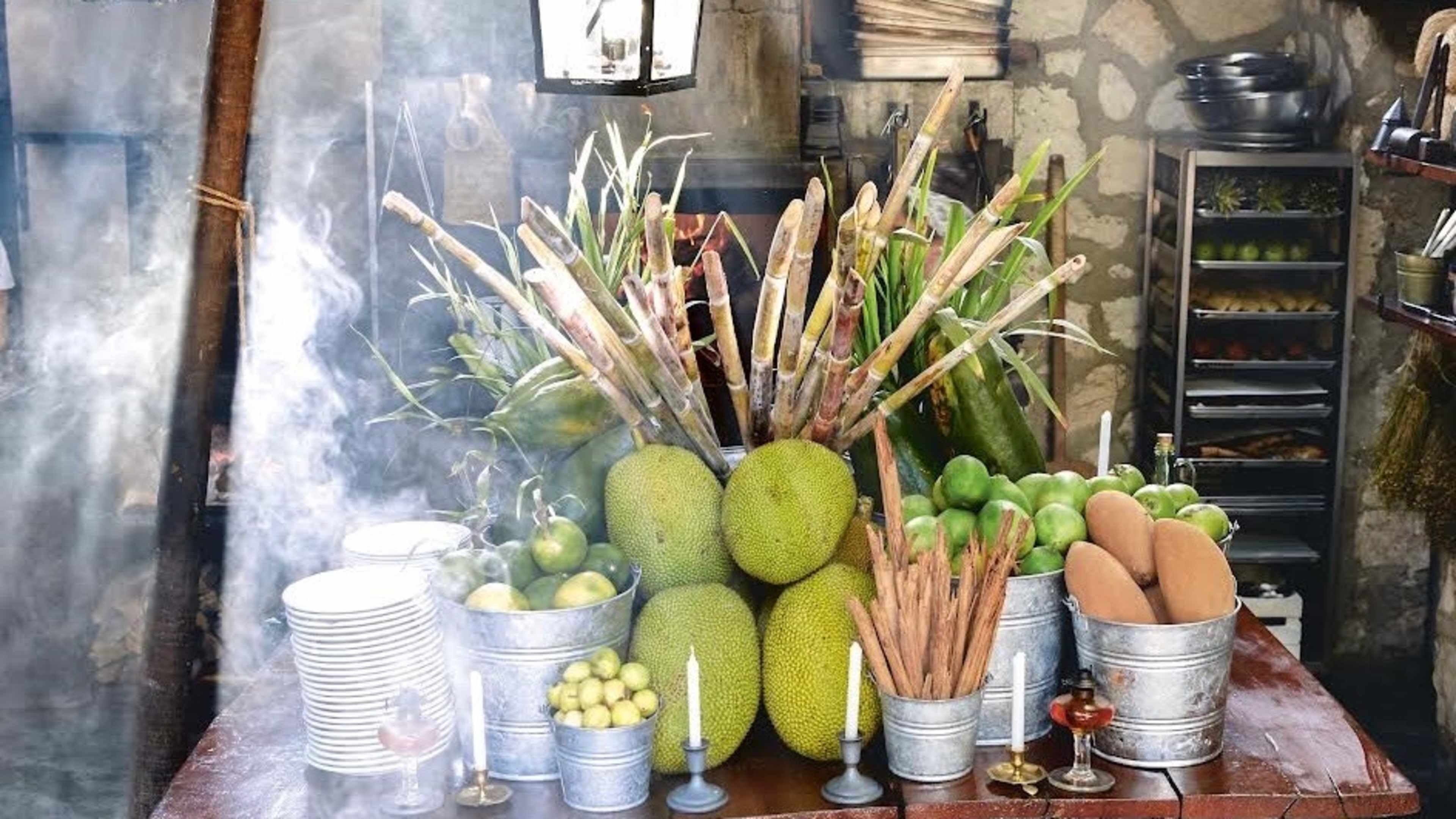 A table with fruits and breadsticks at Hartwood.