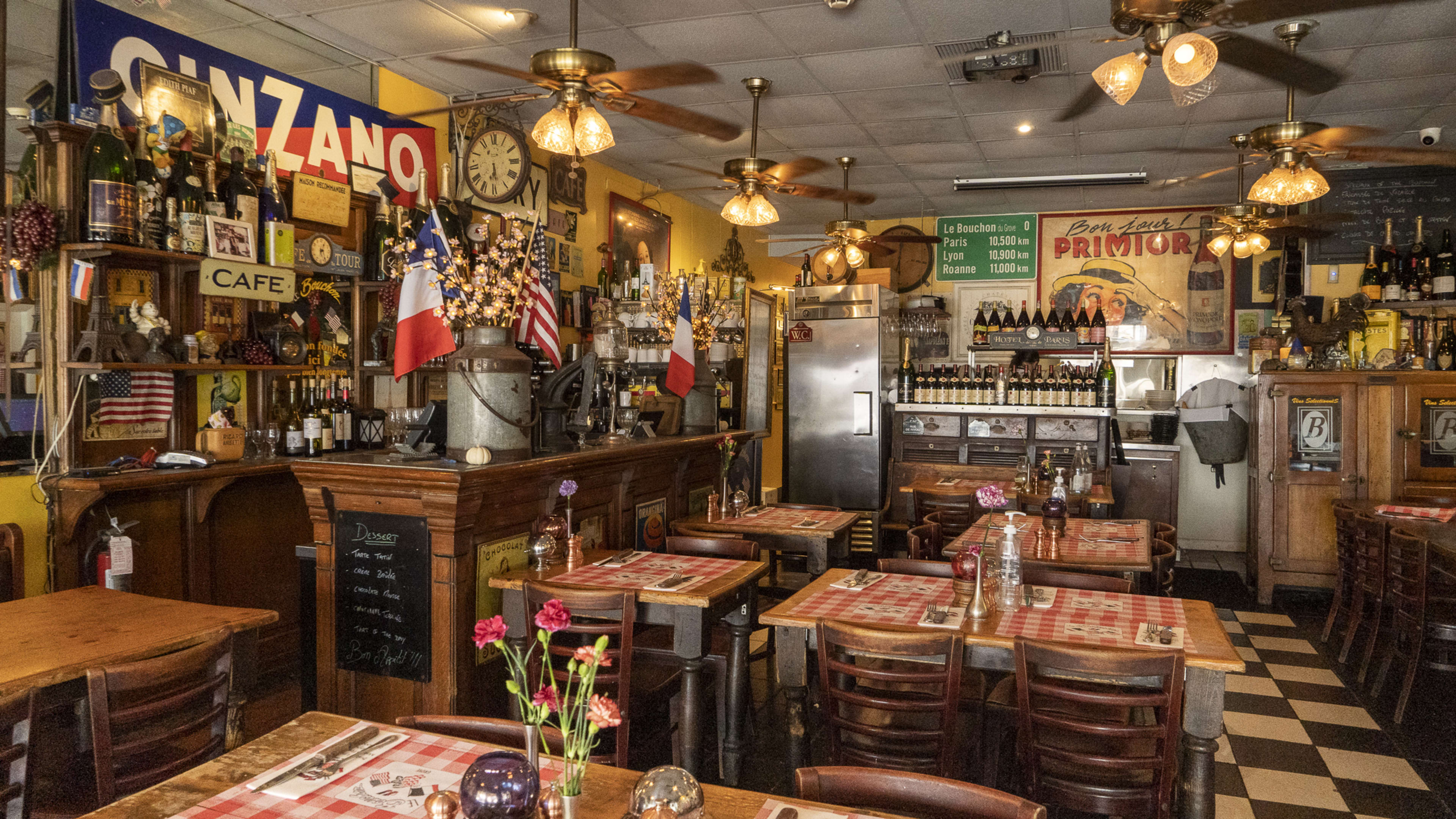 The busy dining room of Le Bouchon Du Grove, which looks very French.