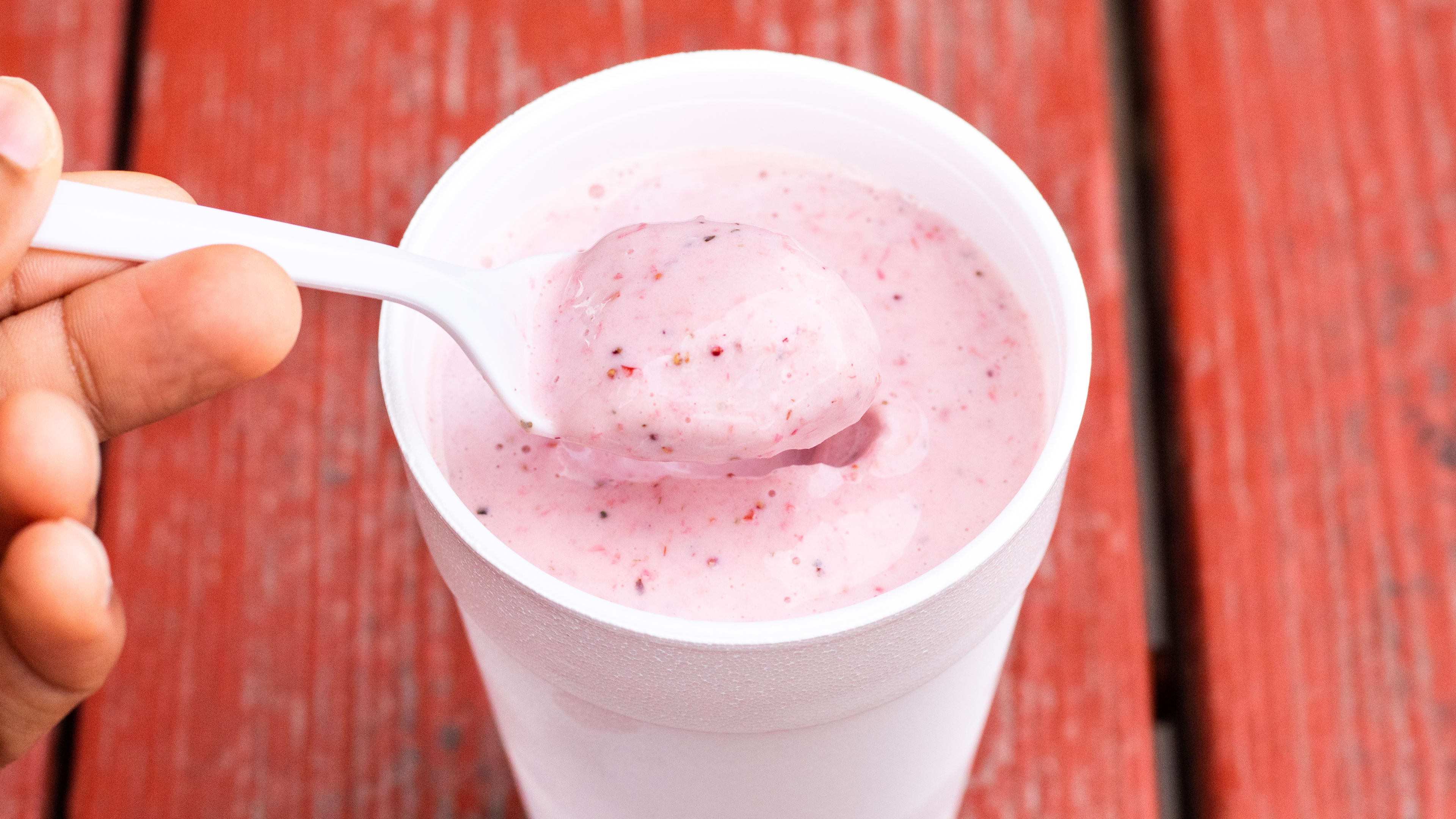 Strawberry milkshake in a styrofoam cup