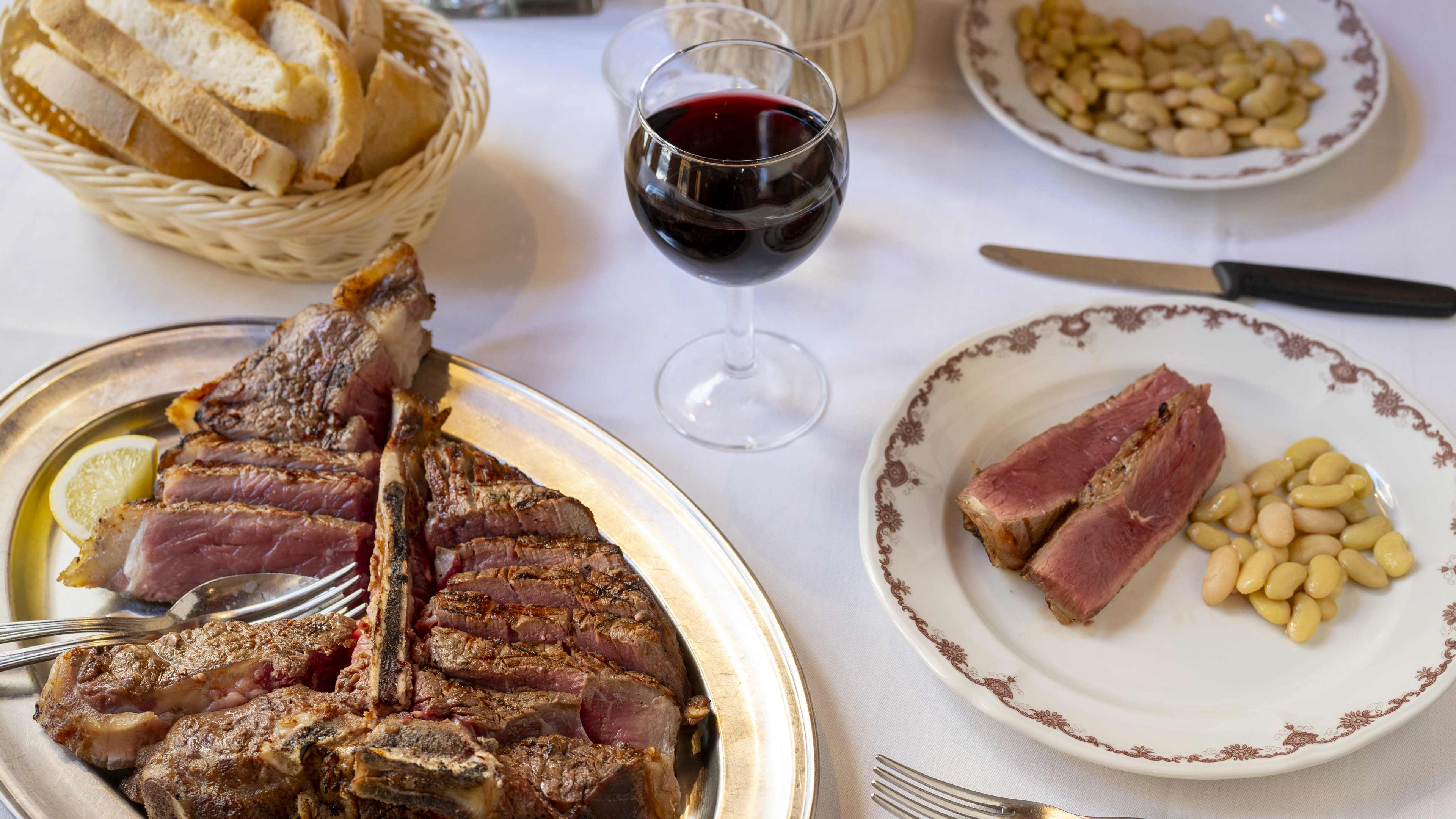 Spread of steak and sides at Trattoria Ruggero