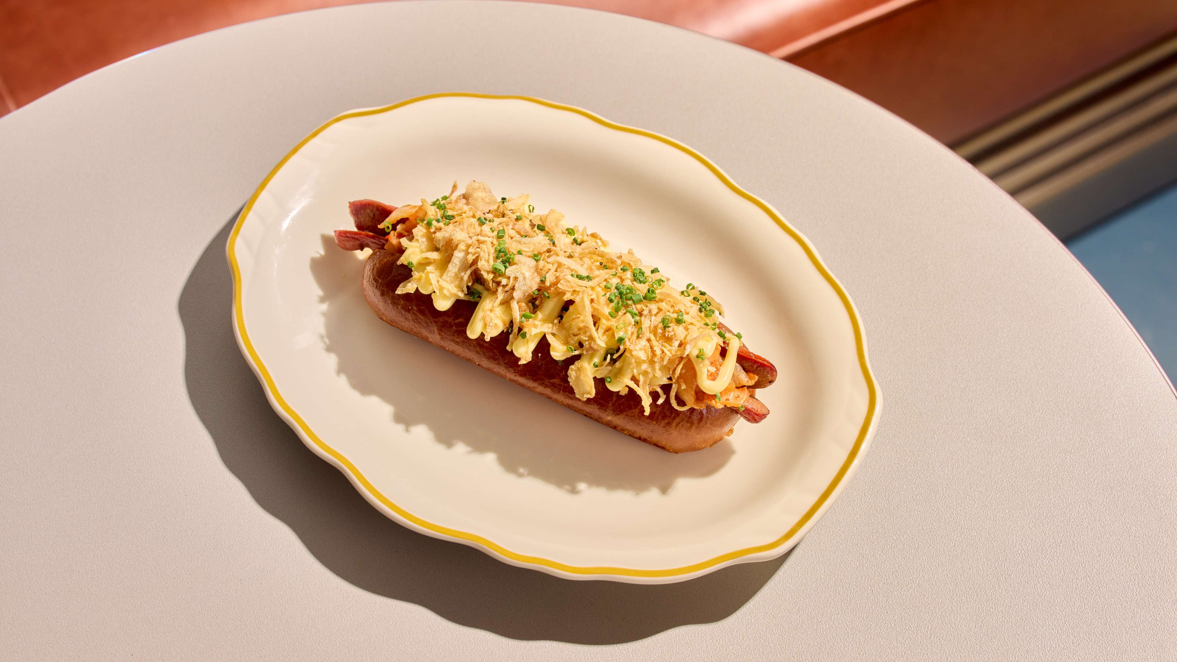 a hot dog with white kimchi