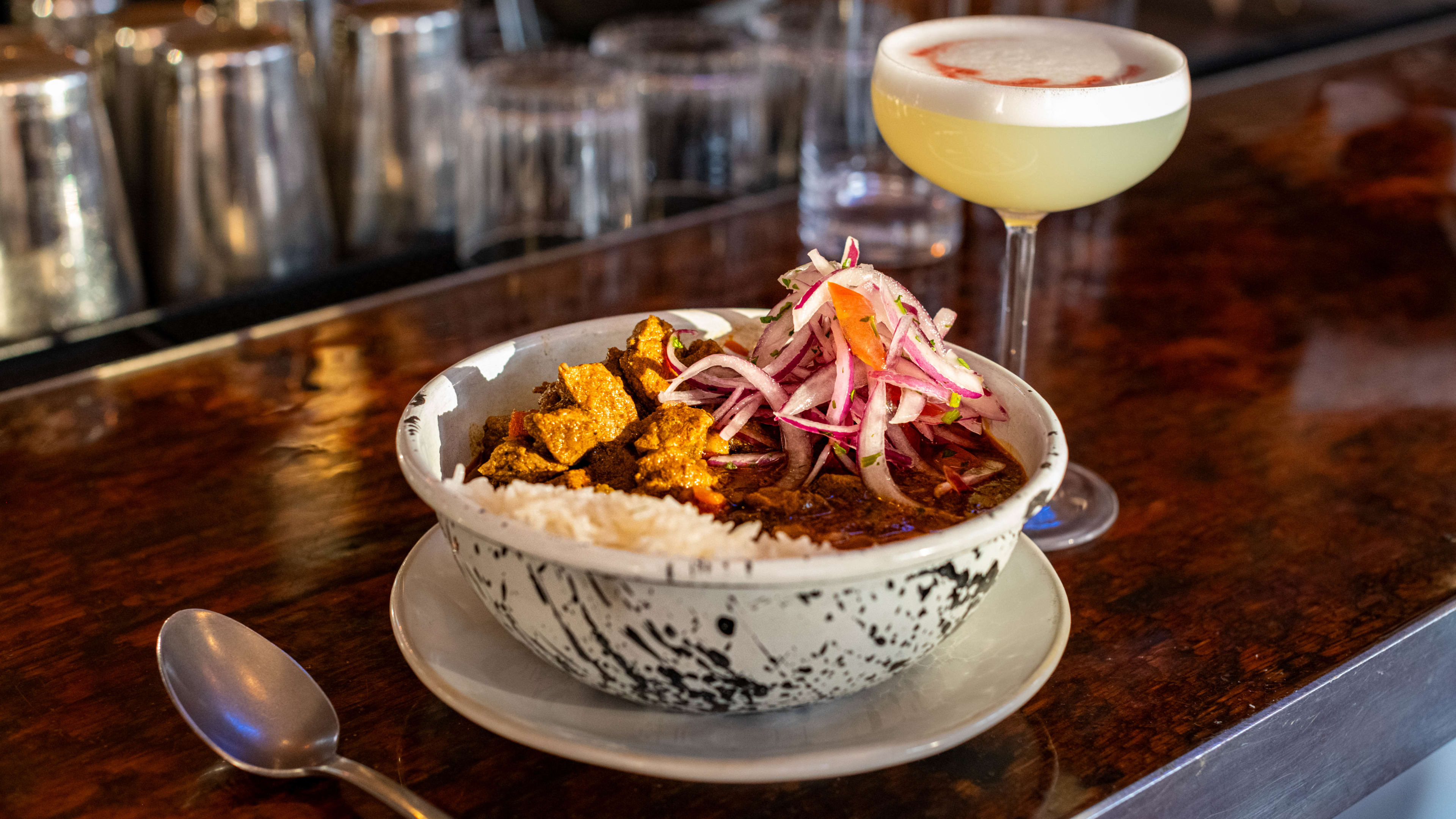 Dish and cocktail on bar