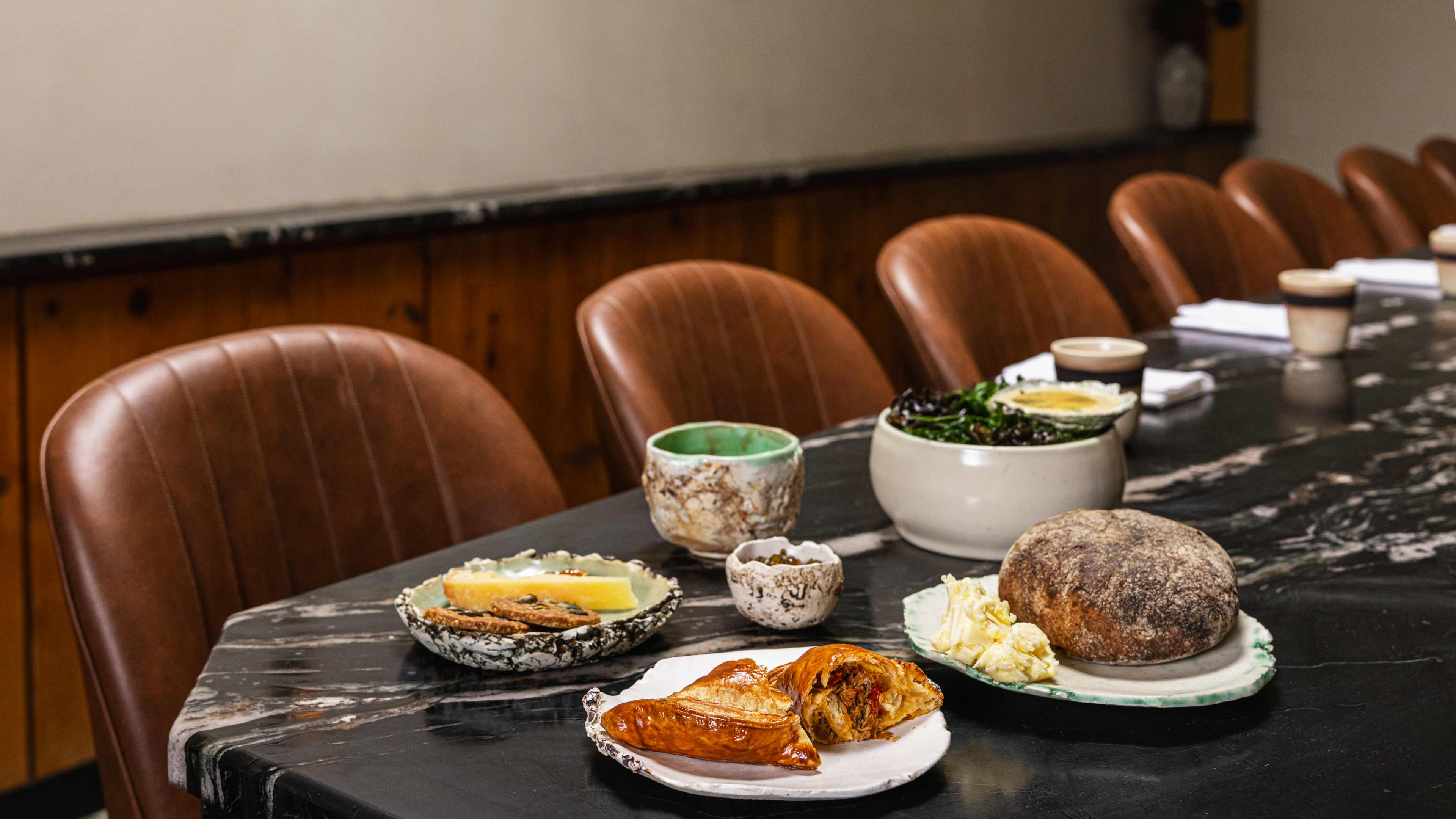 A food spread on the counter at Blanca.