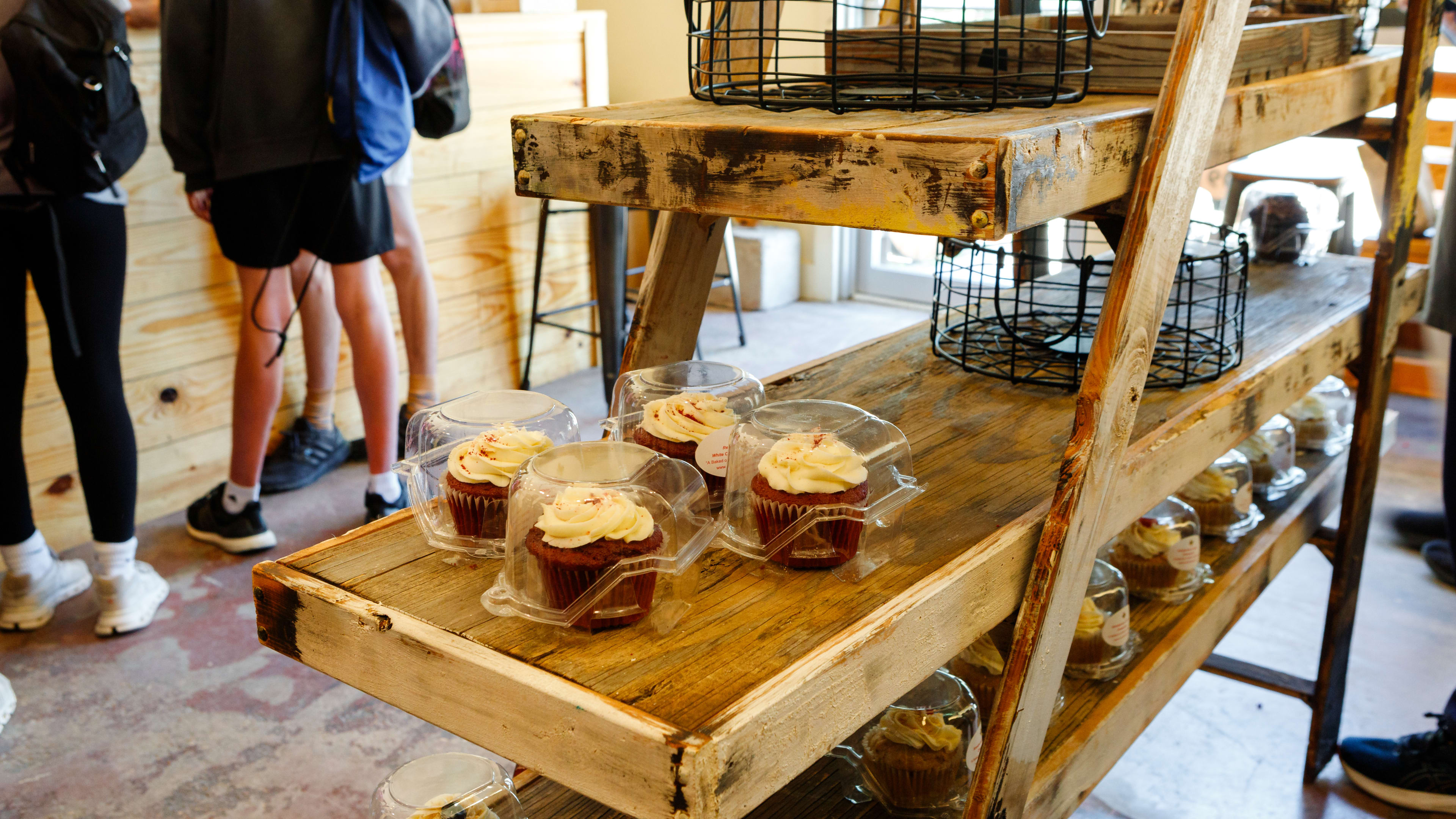 Cupcakes on shelves at Crumbville, TX.