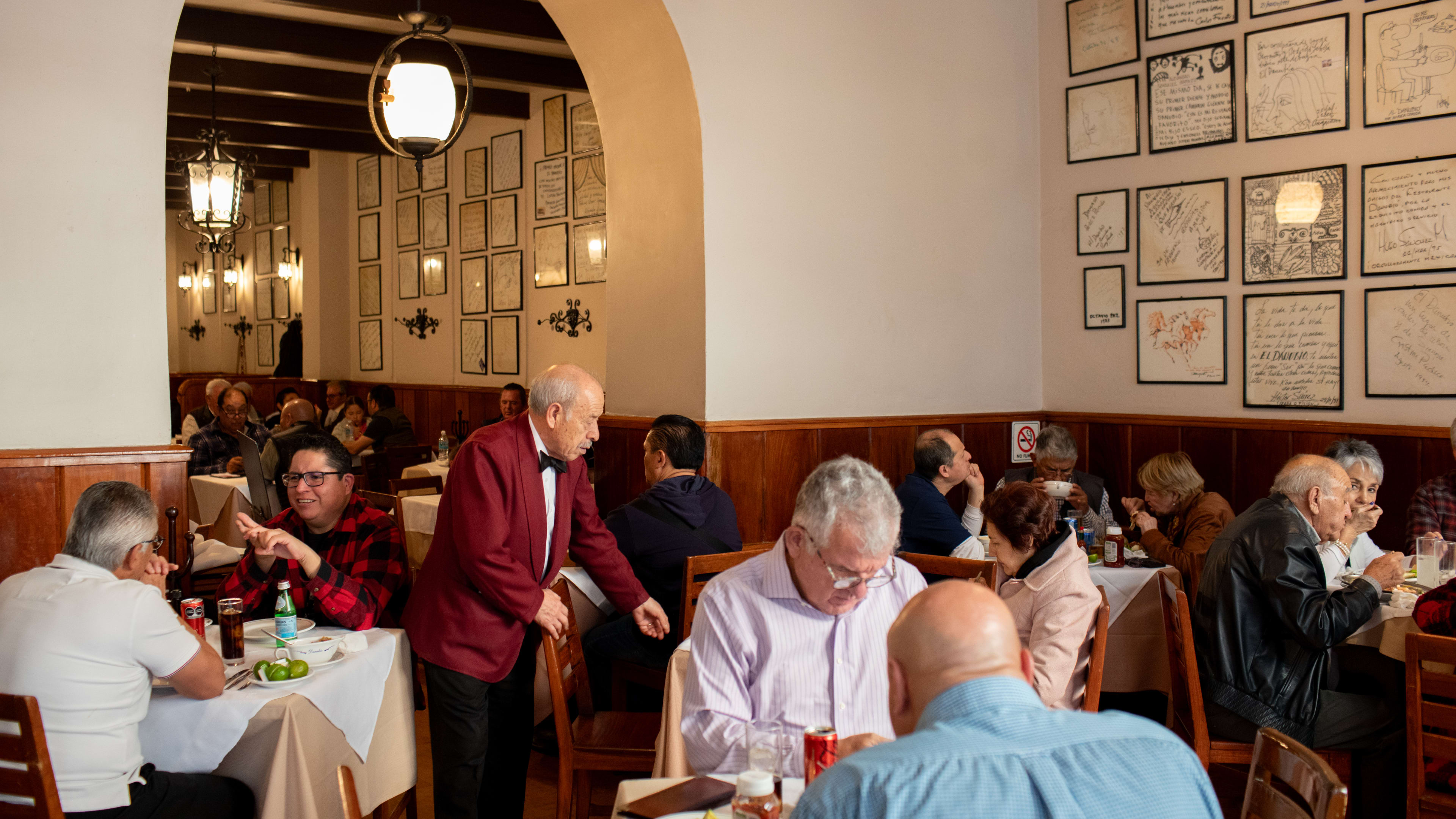 A server waiting tables at Danubio, a popular seafood restaurant in Mexico City