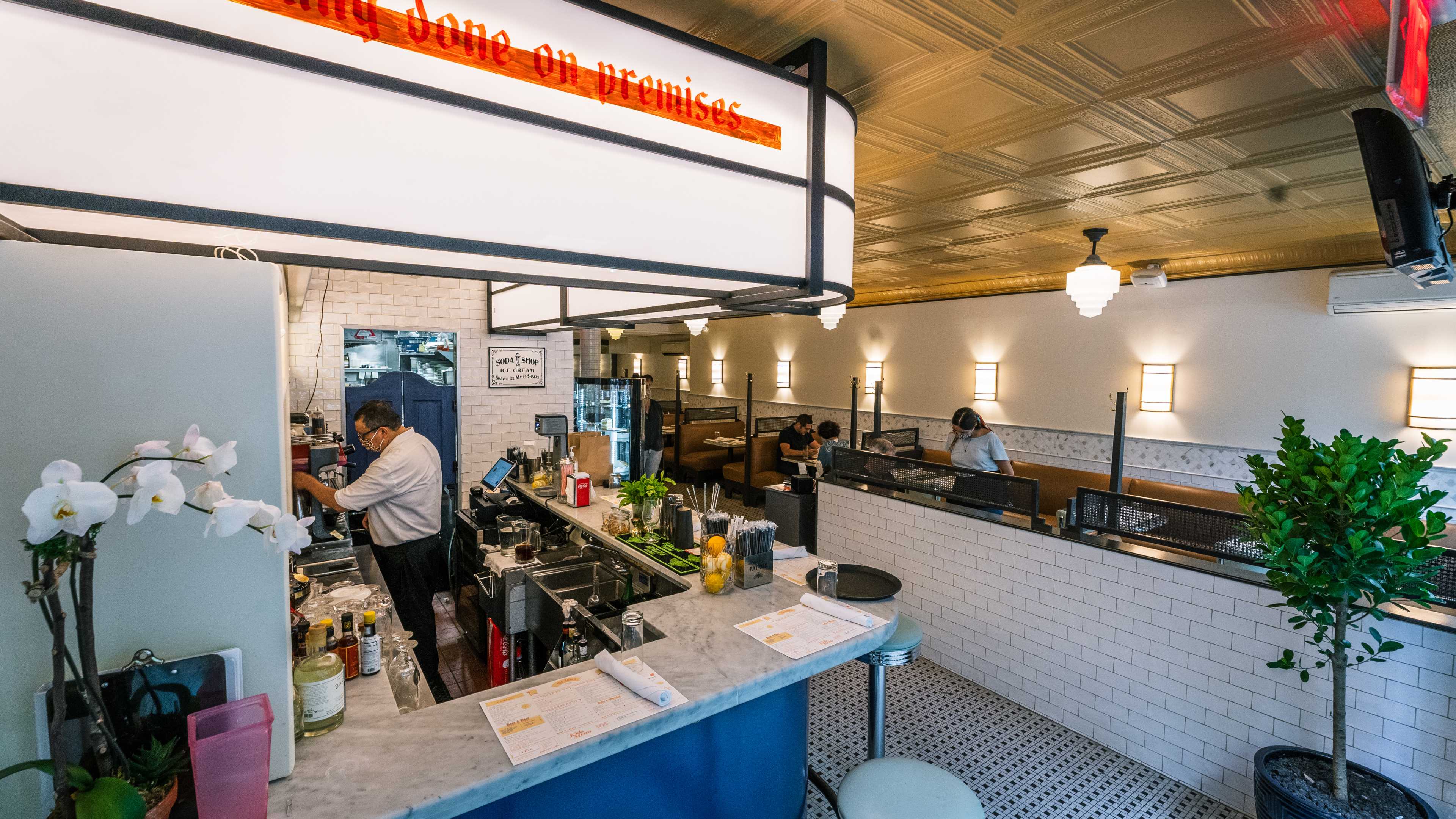 bar counter with sign that says baking done on premises.