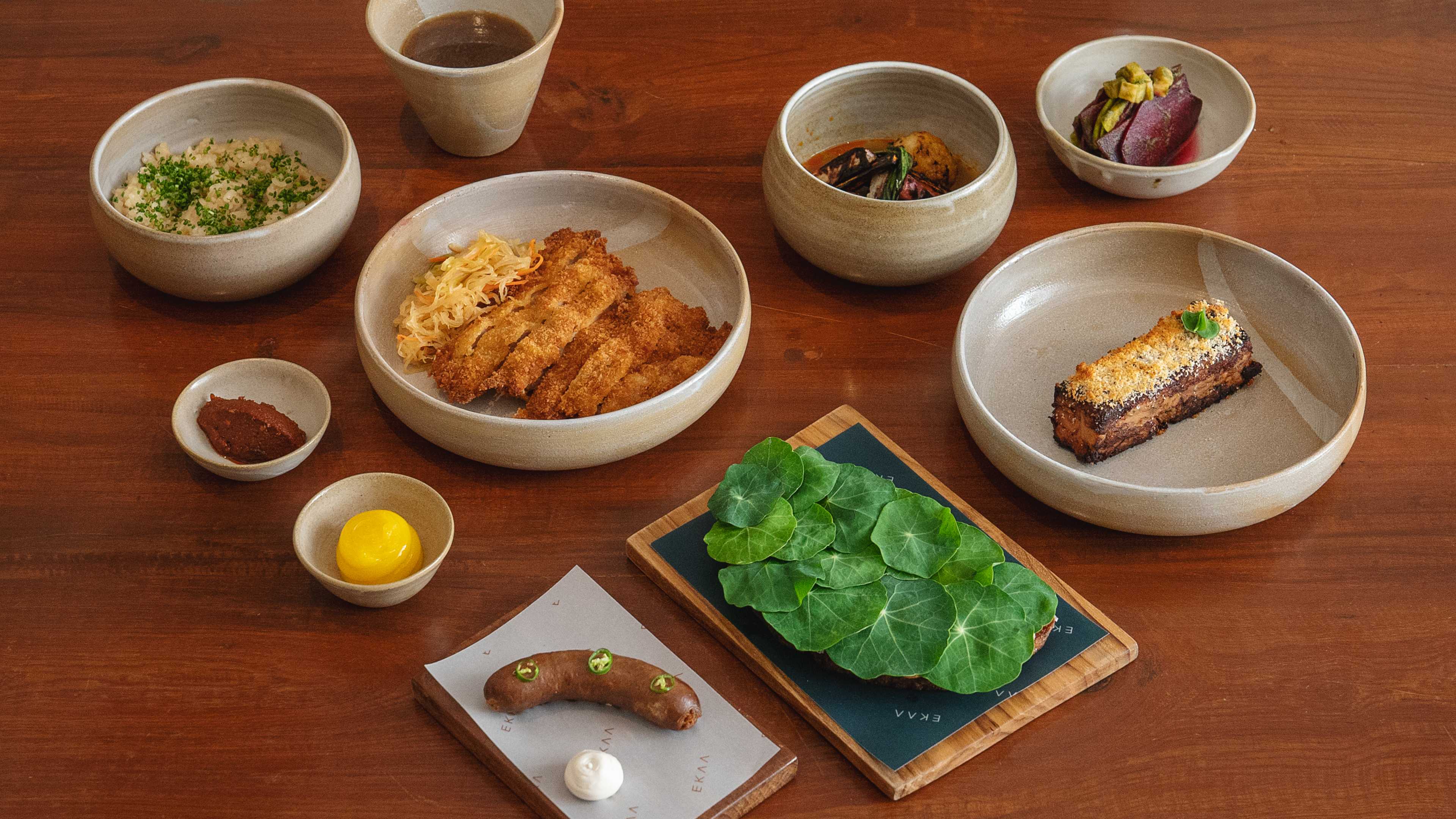 Spread of small dishes in gray ceramic tableware at Ekaa