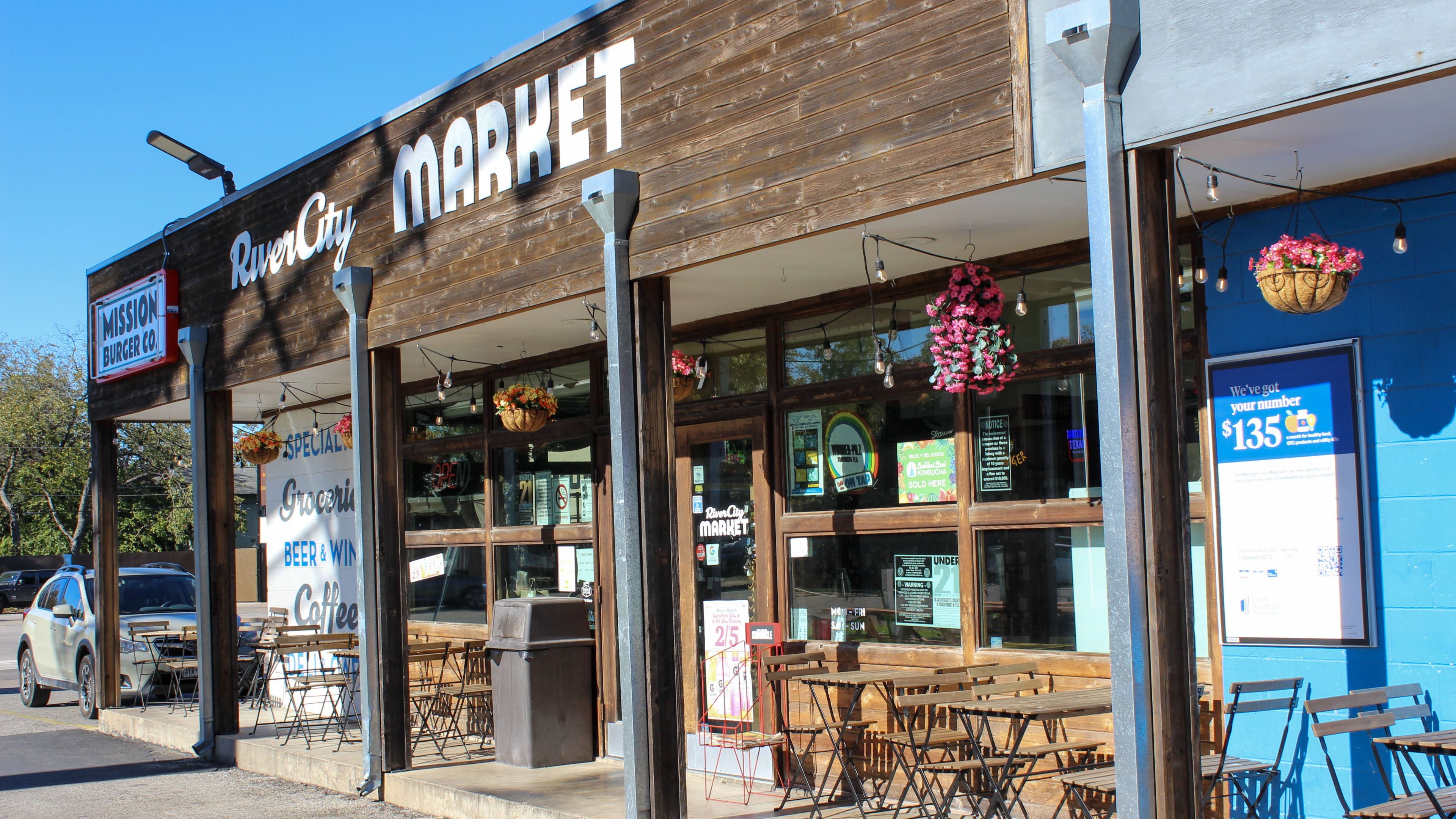 The wooden and blue exterior of Mission Burger.